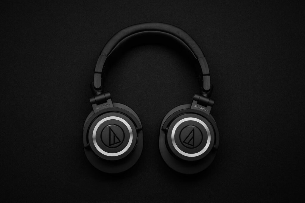 top view photo of black wireless headphones